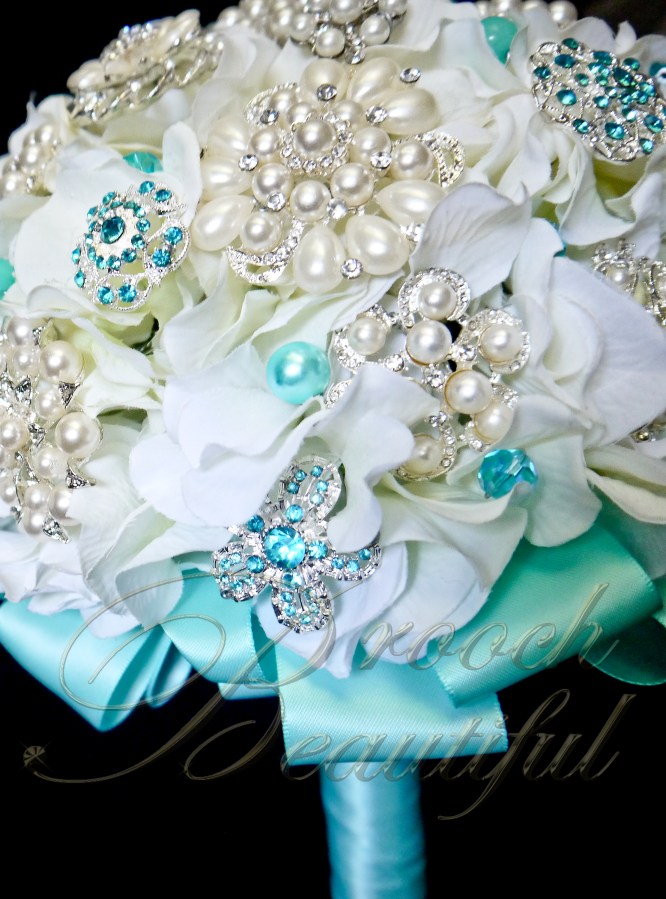 teal pool blue white ivory hydrangea broach bouquet
